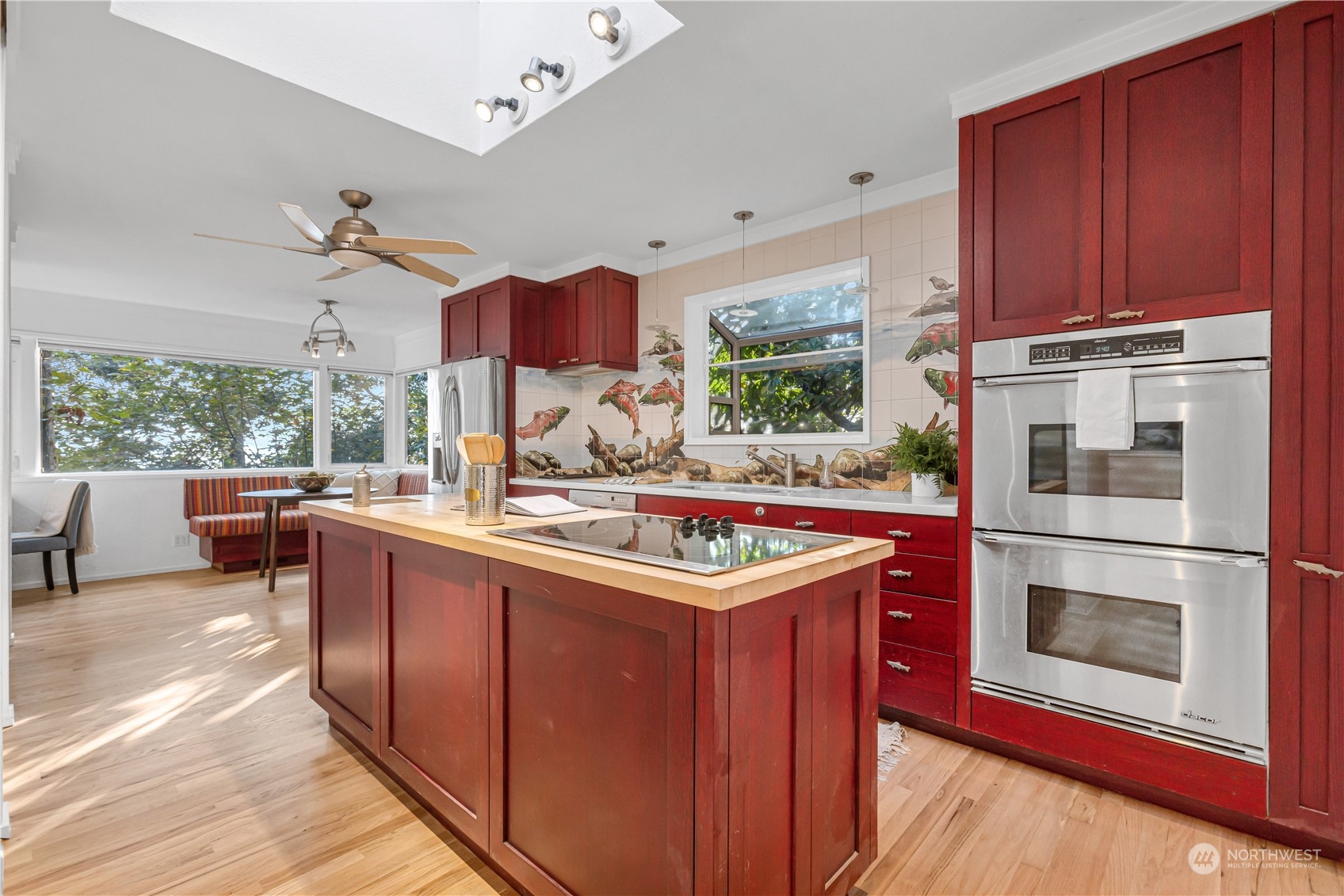 436 36th Avenue Seattle, WA 98122 - Photo 15 of 39 a kitchen with stainless steel appliances granite countertop a stove a sink and a microwave