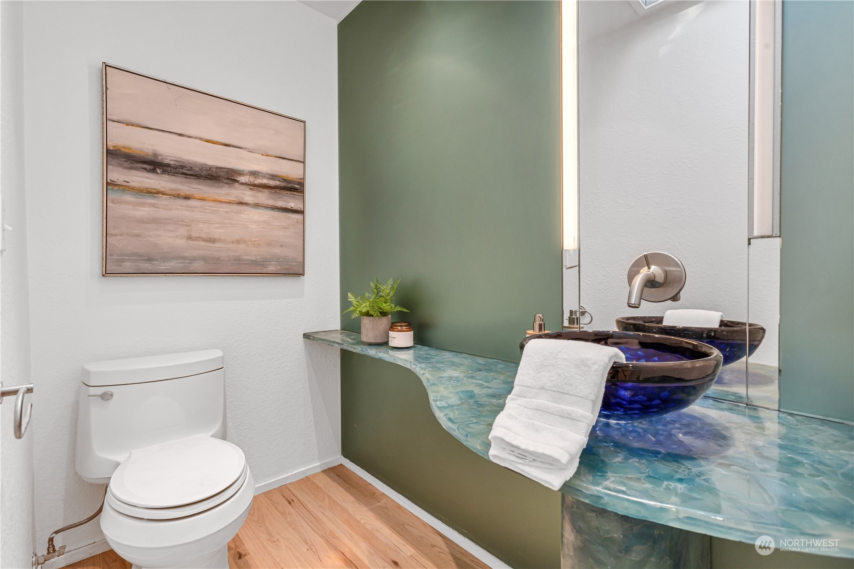 436 36th Avenue Seattle, WA 98122 - Photo 16 of 39 a view of a workspace room with wooden floor and mirror