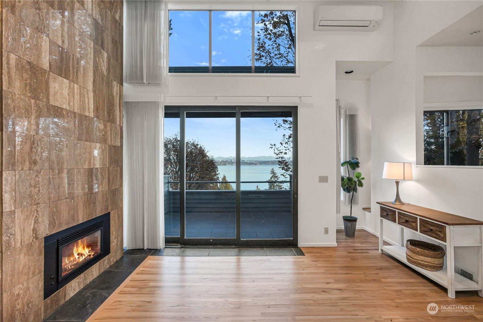 436 36th Avenue Seattle, WA 98122 - Photo 2 of 39 a kitchen with stainless steel appliances wooden floor and a fireplace