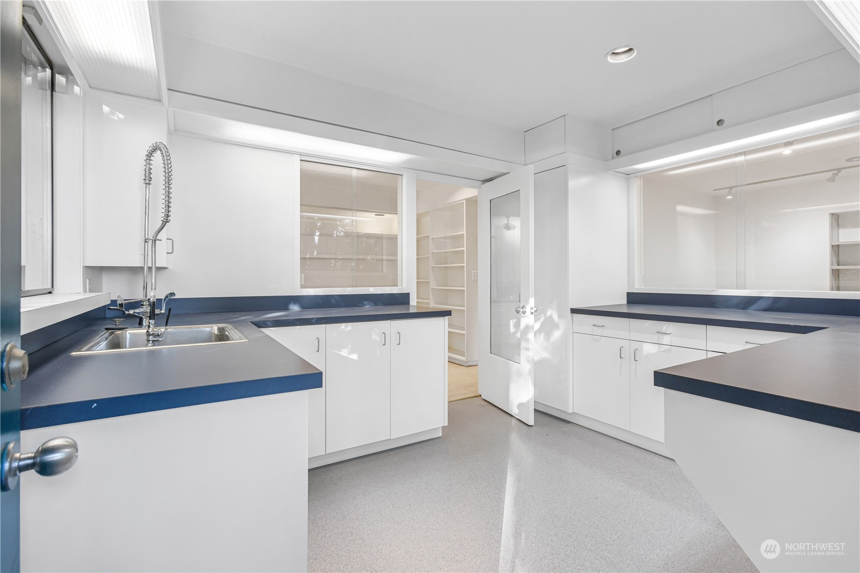 436 36th Avenue Seattle, WA 98122 - Photo 28 of 39 a kitchen with a sink and a refrigerator