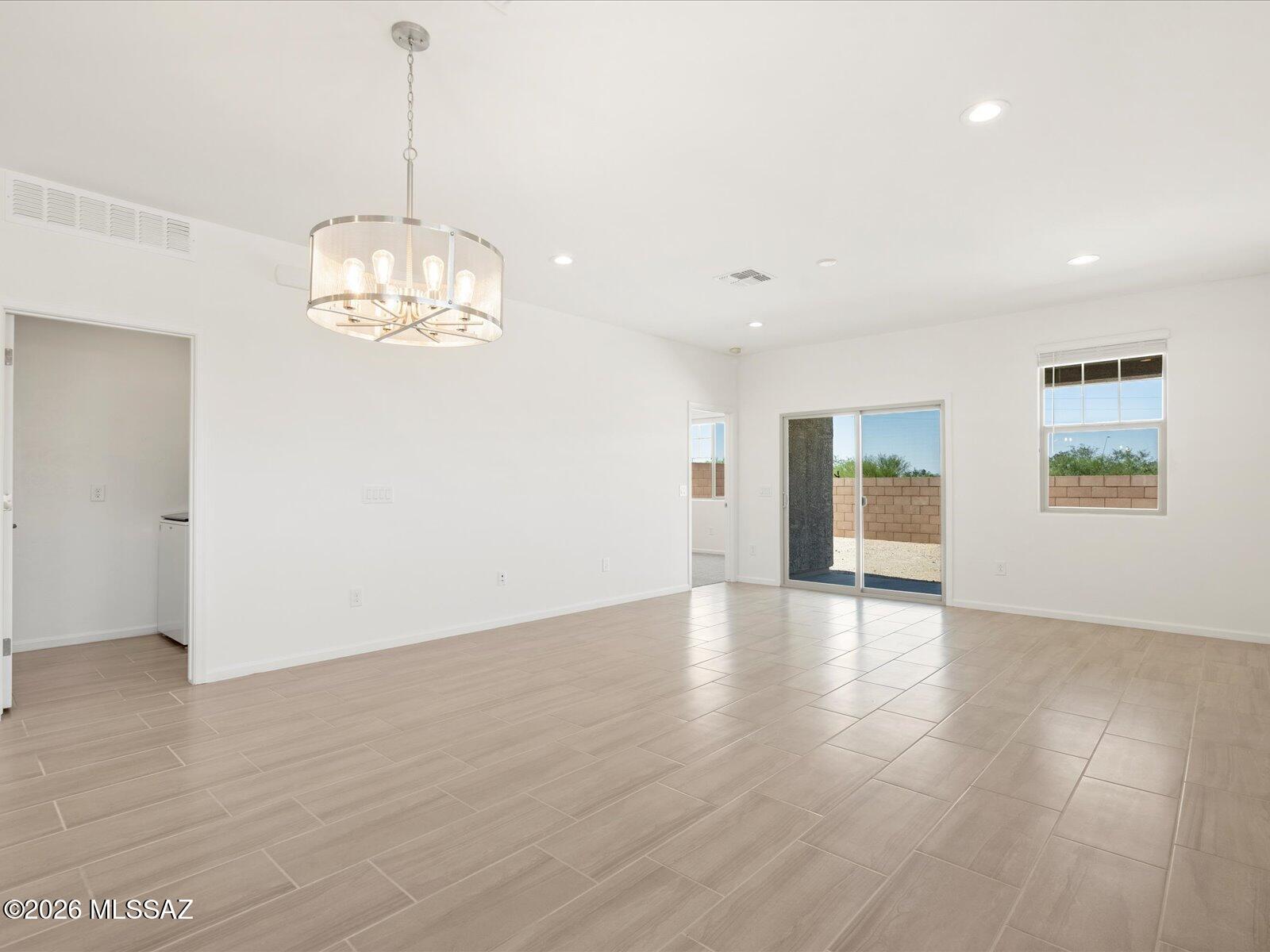 5168 West Bowen House Road Tucson, AZ 85757 - Photo 2 of 13 Photos shown are of a similar floor plan and are intended to provide a close representation of the actual home. Images may include features, finishes, countertops, fixtures, flooring, cabinets, color of cabinets, furnishings, or decorator elements that are not part of the standard offering. While this specific home may include some of these features, please note it may not include all.