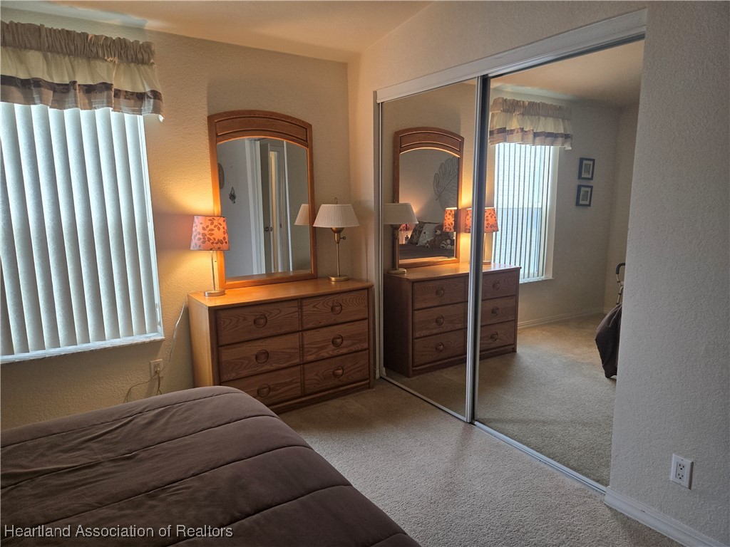 3312 Beartooth Pass Sebring, FL 33872 - Photo 20 of 39 a bedroom with two beds and dresser