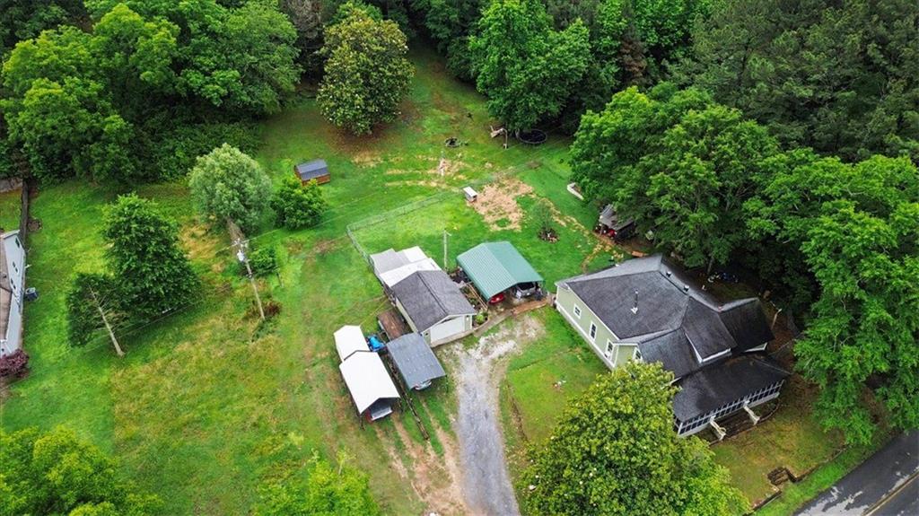483 Coal Road Northwest Resaca, GA 30735 - Photo 54 of 56 an aerial view of a house with swimming pool and garden