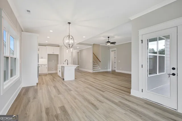 a view of a house with wooden floor and a large window