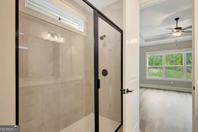 a view of a bathroom with a glass shower door