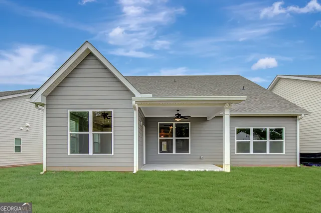 a view of a lake with houses in the back