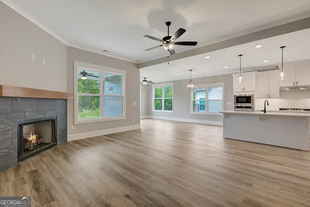 a view of kitchen with cabinets and wooden floor