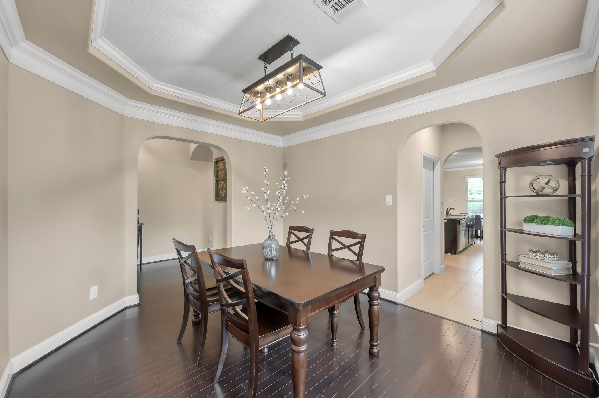 23 Rancher's Trail Tomball, TX 77375 - Photo 17 of 40 Experience elegance in the formal dining area, featuring exquisite wood floors and intricate ceiling details, perfect for hosting memorable dinners.