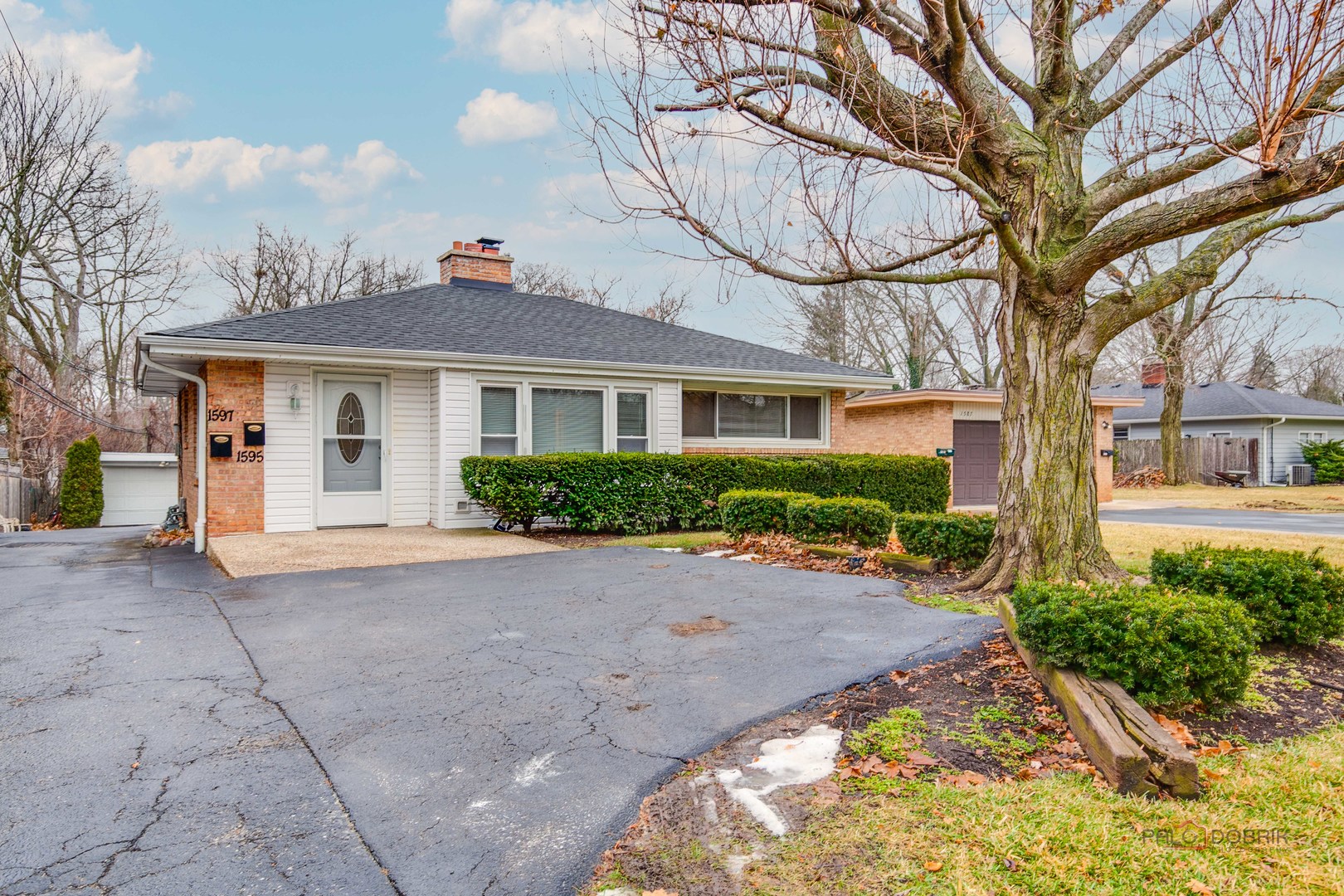 a view of house with yard