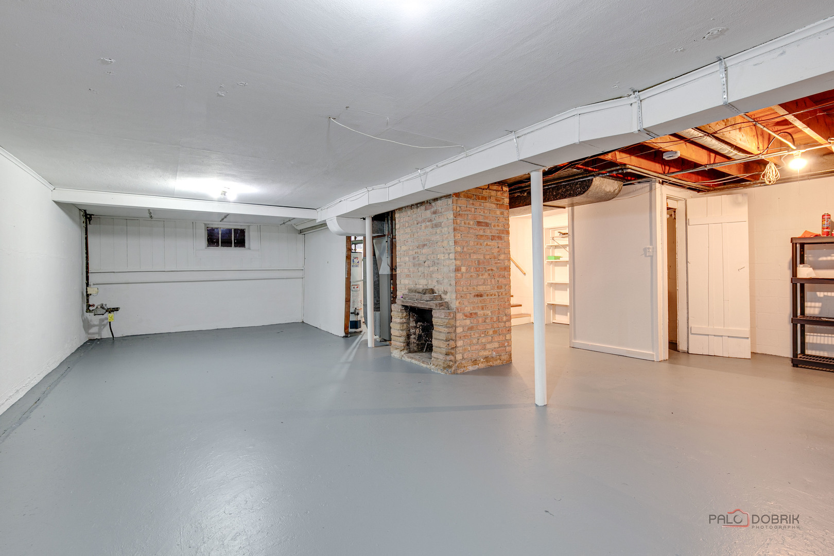 1595 North McKinley Road, Unit 1 Lake Forest, IL 60045 - Photo 22 of 24 a view of empty room with wooden floor and fireplace