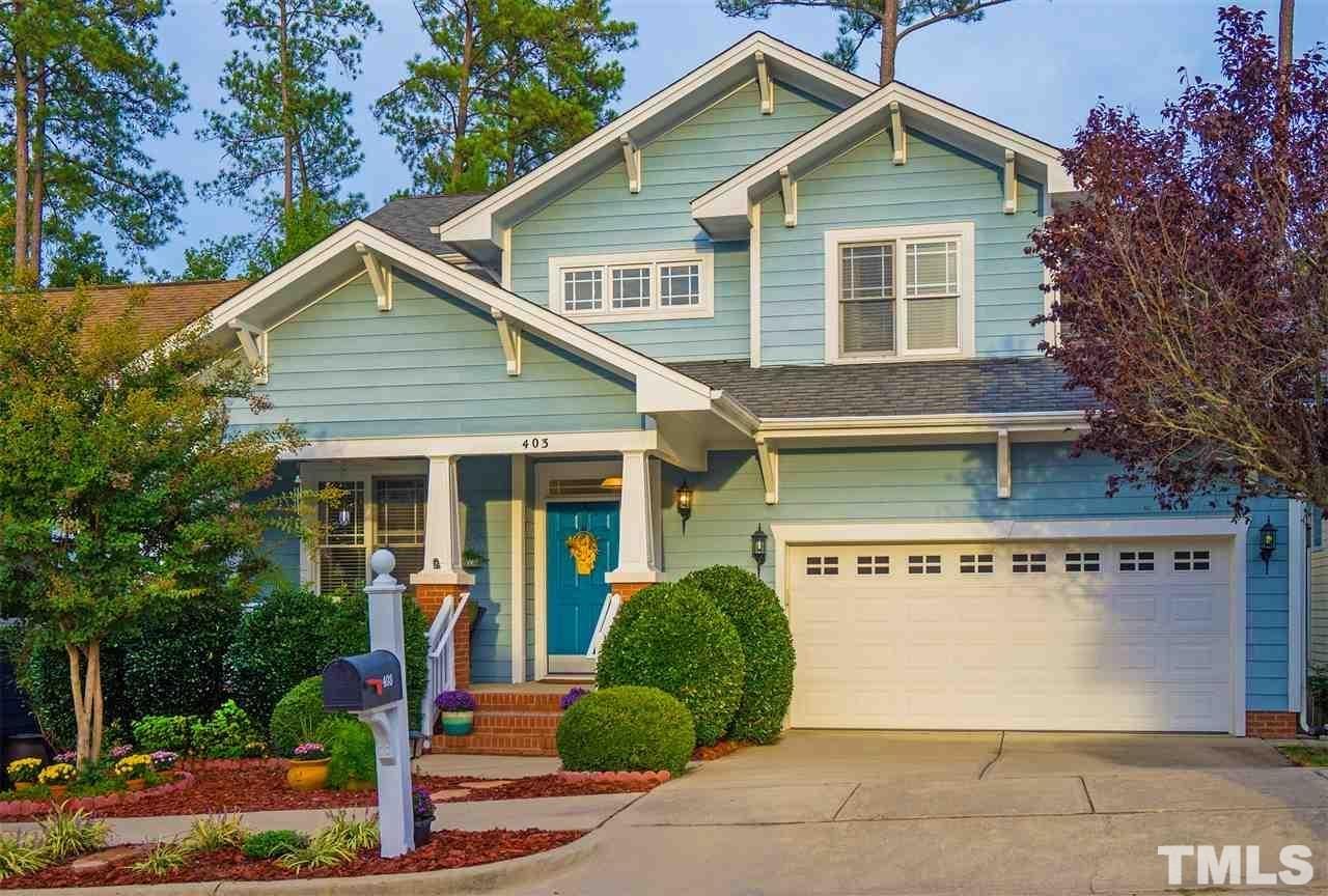 403 Homegate Circle Apex, NC 27502 - Photo 1 of 14 a view of a house with garage and plants