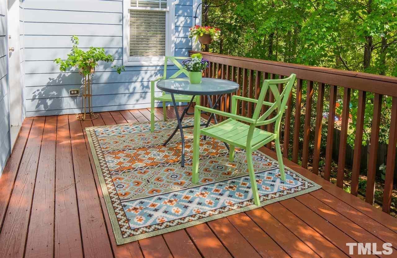 403 Homegate Circle Apex, NC 27502 - Photo 13 of 14 a view of balcony with wooden floor and outdoor seating