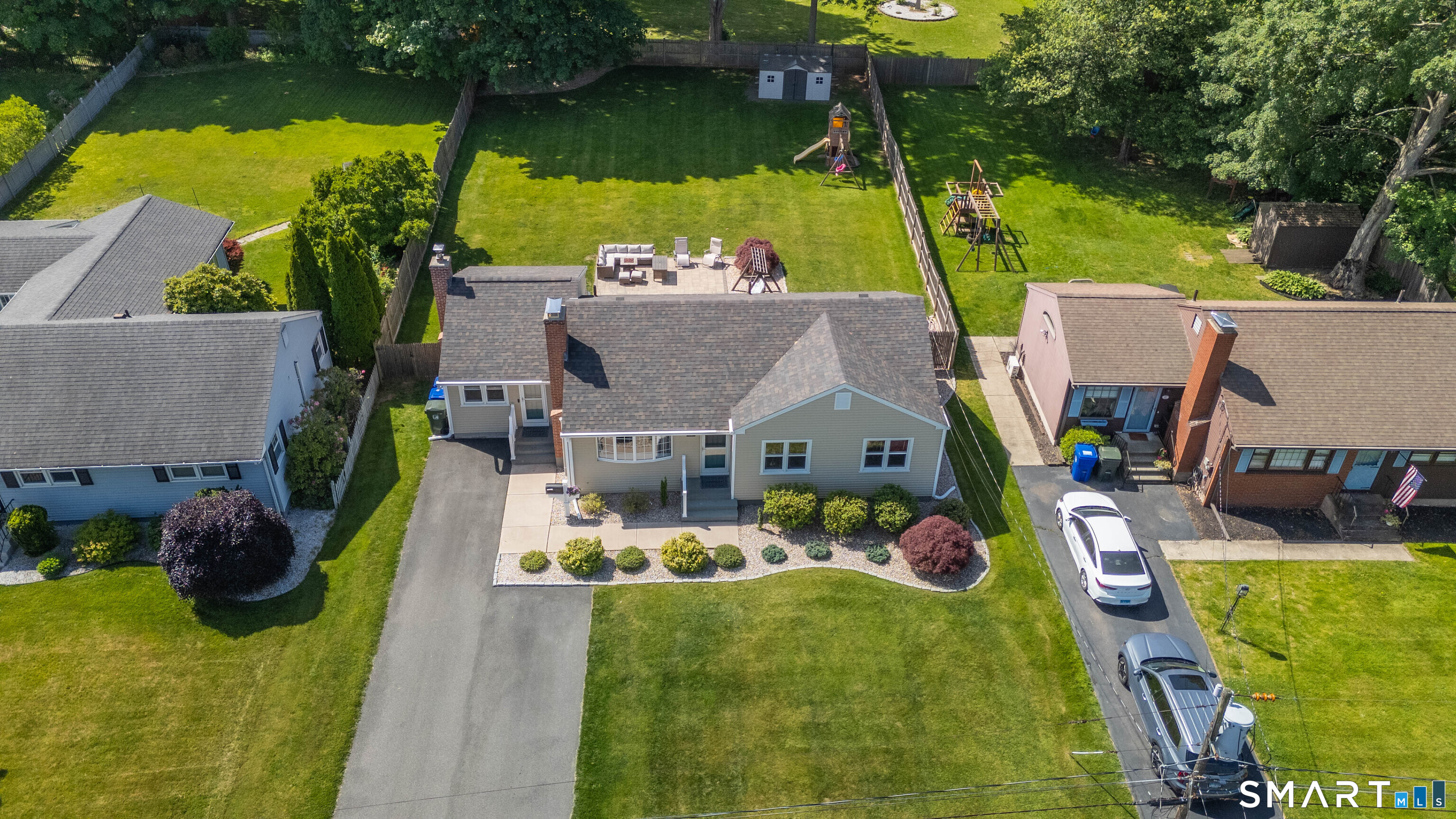 87 Lydall Road Newington, CT 06111 - Photo 6 of 35 an aerial view of a house with a garden and swimming pool