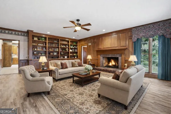 a kitchen with stainless steel appliances kitchen island granite countertop a sink stove and refrigerator