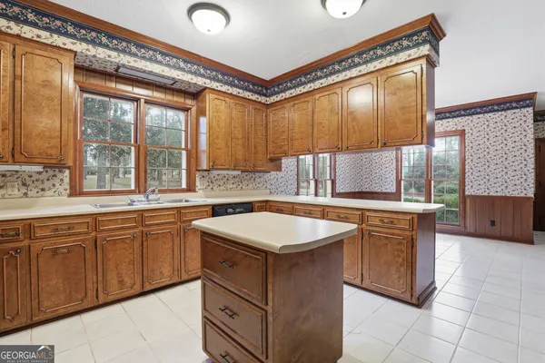 a view of empty room with a fireplace and cabinet