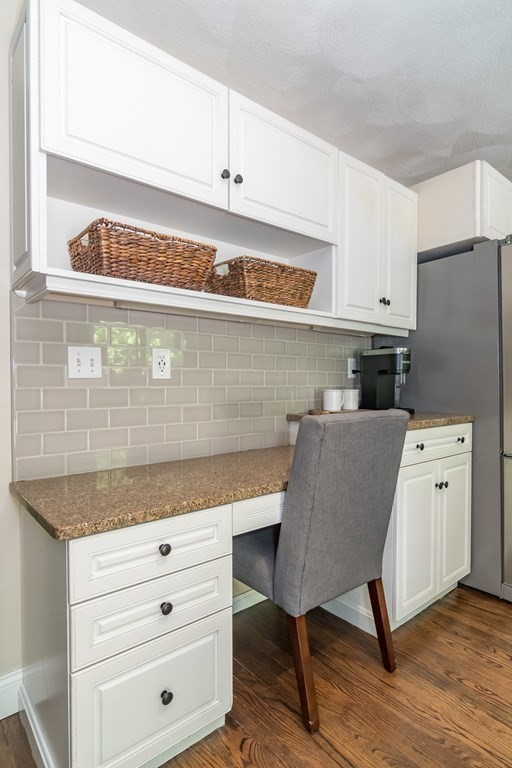 50 Ash Street Rehoboth, MA 02769 - Photo 11 of 34 a kitchen with cabinets appliances and a wooden floor