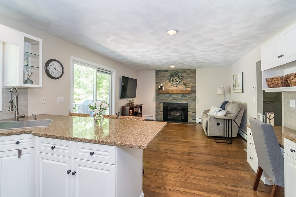 50 Ash Street Rehoboth, MA 02769 - Photo 12 of 34 a living room with furniture and a fireplace