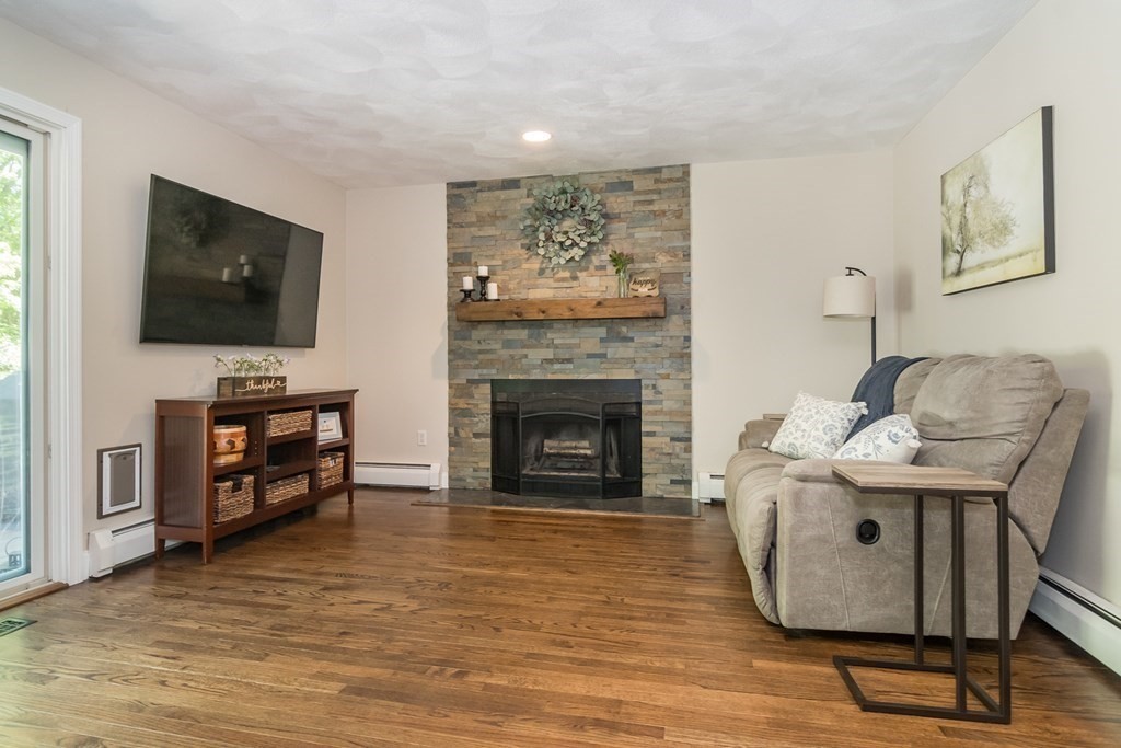 50 Ash Street Rehoboth, MA 02769 - Photo 13 of 34 a living room with furniture and a flat screen tv