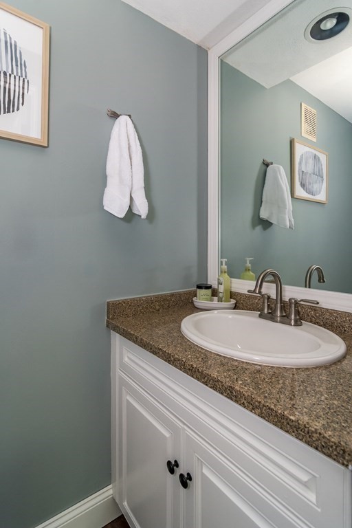 50 Ash Street Rehoboth, MA 02769 - Photo 16 of 34 a bathroom with a granite countertop sink and a mirror