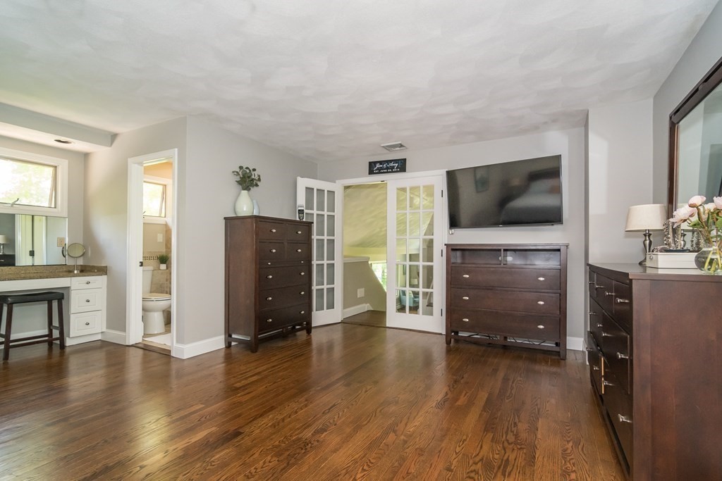 50 Ash Street Rehoboth, MA 02769 - Photo 18 of 34 a living room with furniture and a flat screen tv