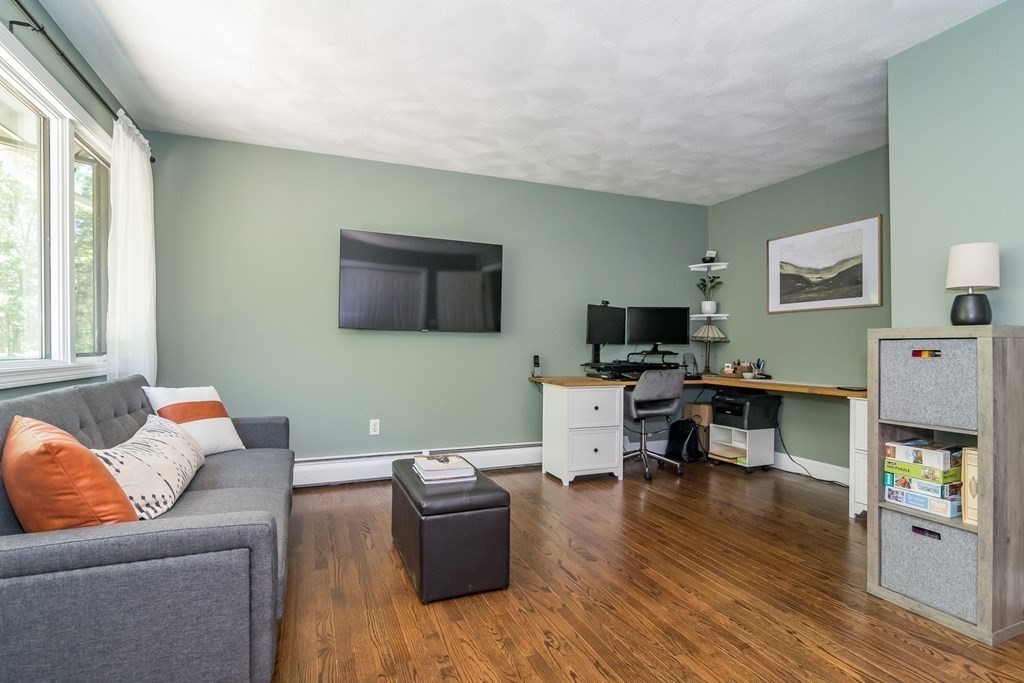 50 Ash Street Rehoboth, MA 02769 - Photo 25 of 34 a living room with furniture and a flat screen tv