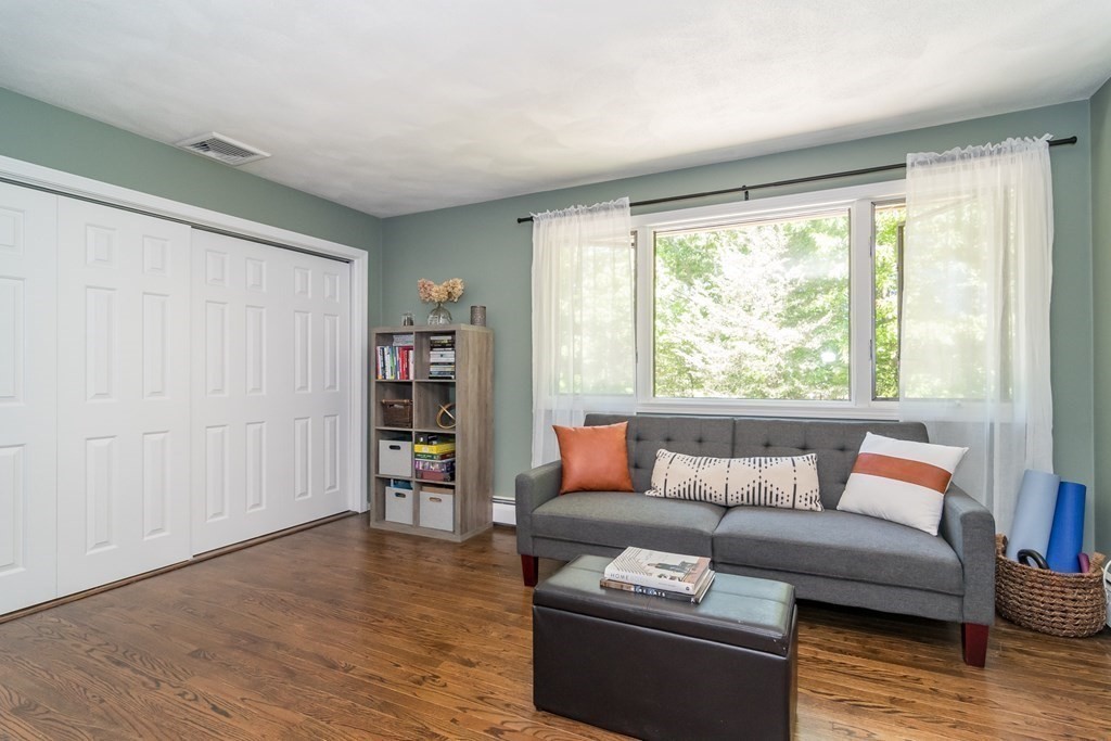 50 Ash Street Rehoboth, MA 02769 - Photo 26 of 34 a living room with furniture and a wooden floor