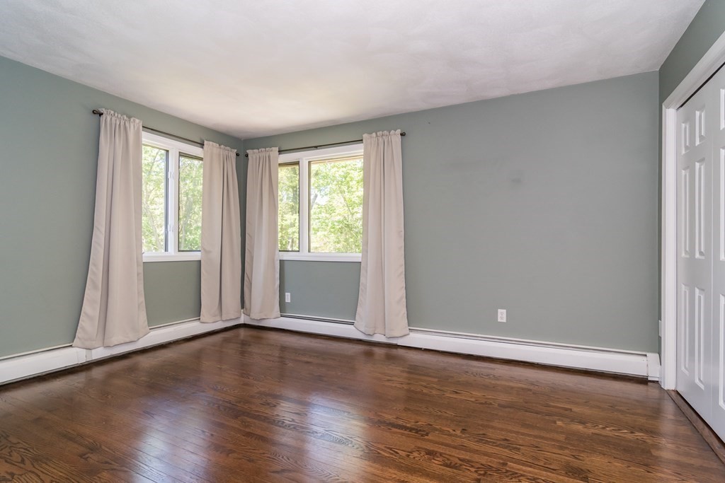 50 Ash Street Rehoboth, MA 02769 - Photo 27 of 34 a view of an empty room with wooden floor and a window
