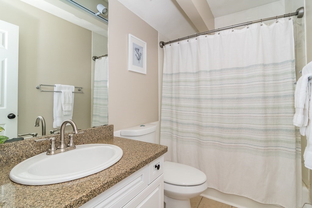 50 Ash Street Rehoboth, MA 02769 - Photo 28 of 34 a bathroom with a granite countertop sink and a mirror