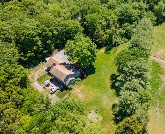 50 Ash Street Rehoboth, MA 02769 - Photo 3 of 34 a backyard of a house with a yard and outdoor seating