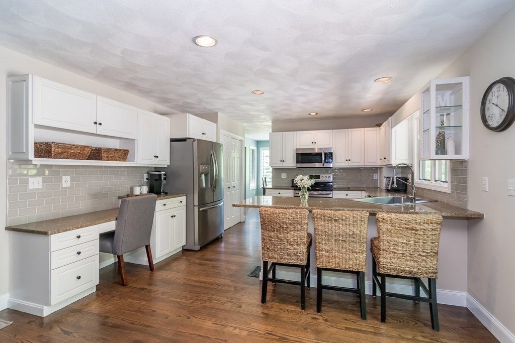 50 Ash Street Rehoboth, MA 02769 - Photo 10 of 34 a living room with stainless steel appliances kitchen island granite countertop furniture and a dining table with kitchen view
