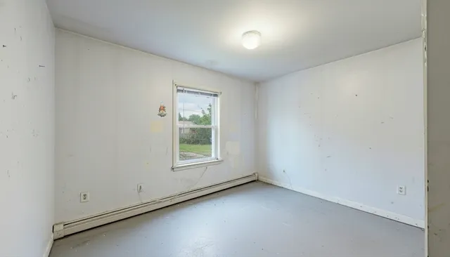 a bathroom with a sink mirror and toilet