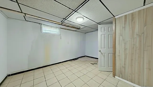 a view of a balcony with chairs and wooden floor