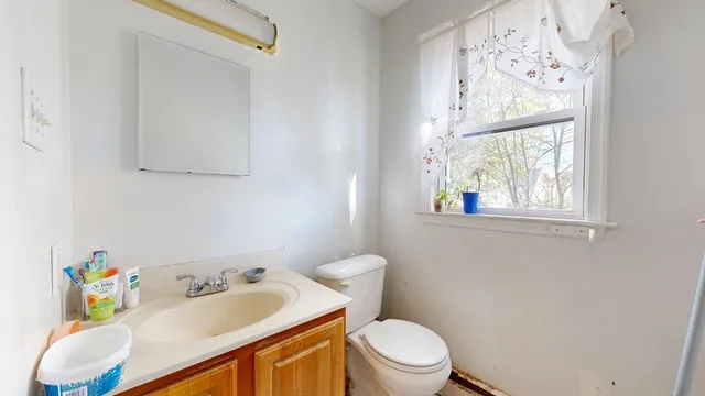 a bedroom with a bed and a tv