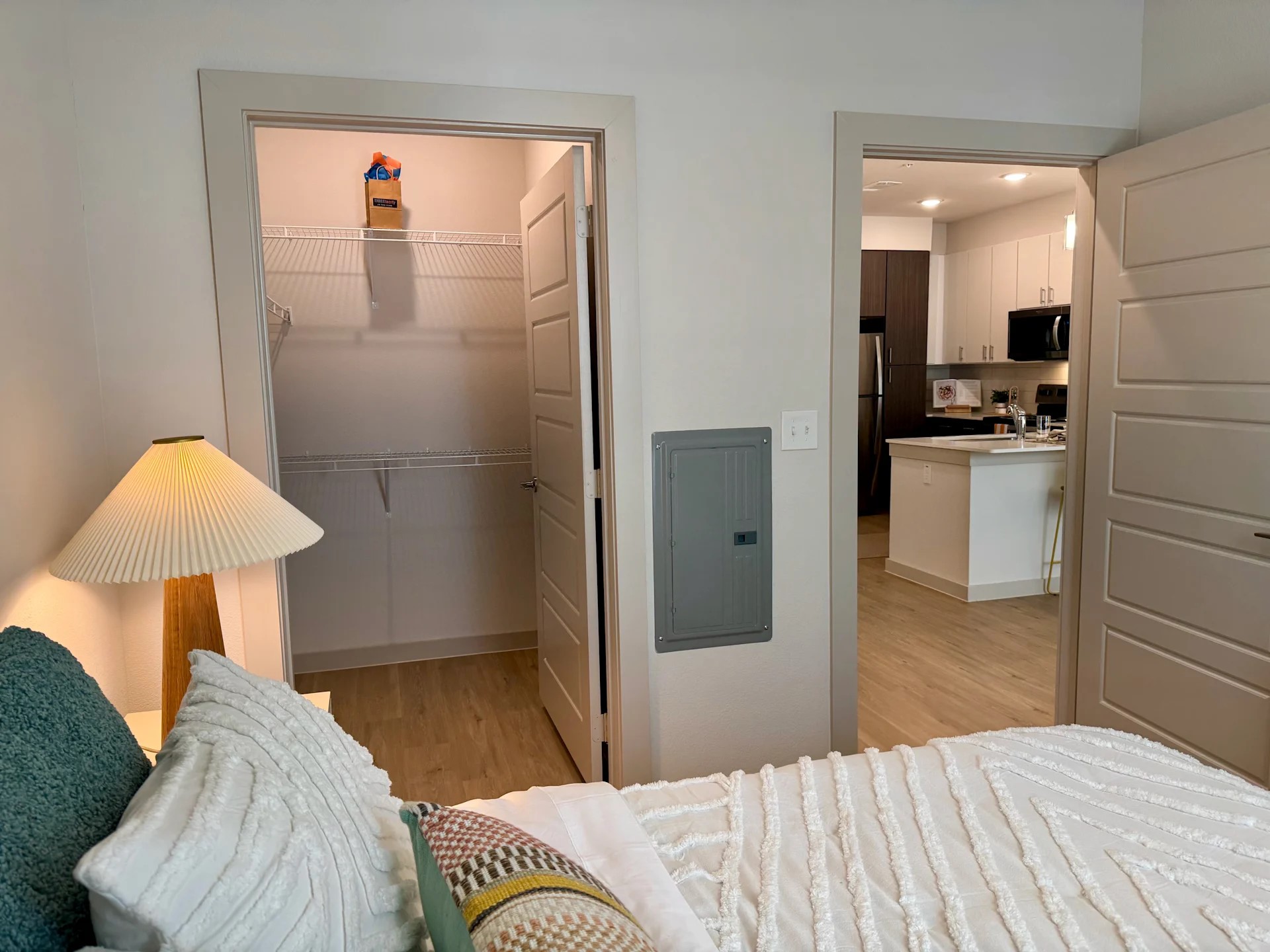 320 Goll Street, Unit 2233 Kyle, TX 78640 - Photo 6 of 19 a bedroom with a bed and a chair