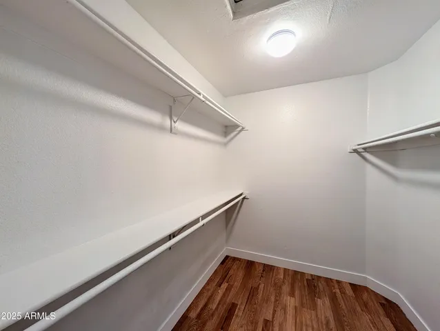 a bathroom with a double vanity sink and mirror
