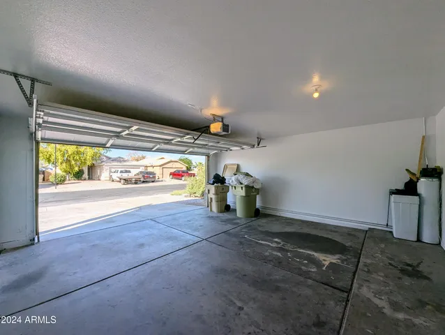 a view of an empty room and a window