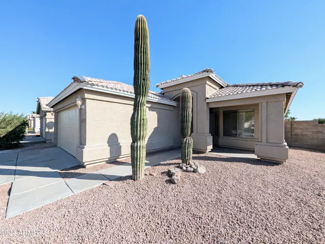 a view of a livingroom with entryway and furniture