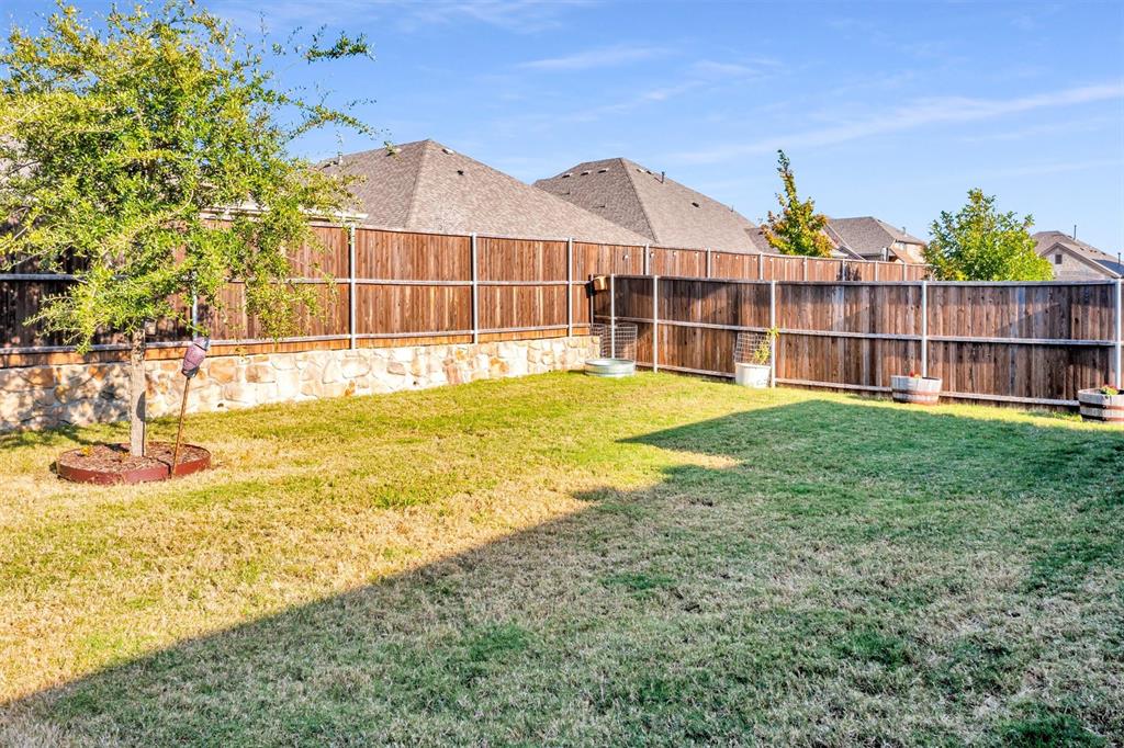 2208 Heaton Street Forney, TX 75126 - Photo 27 of 38 a view of a house with a swimming pool