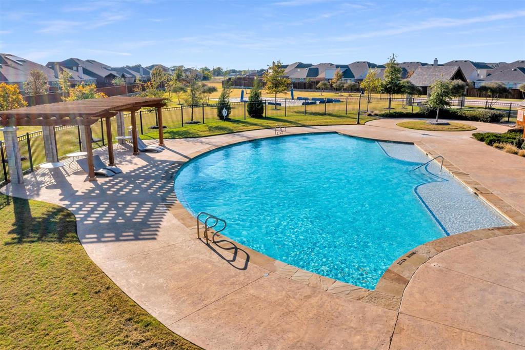 2208 Heaton Street Forney, TX 75126 - Photo 36 of 38 a view of swimming pool with outdoor seating and city view