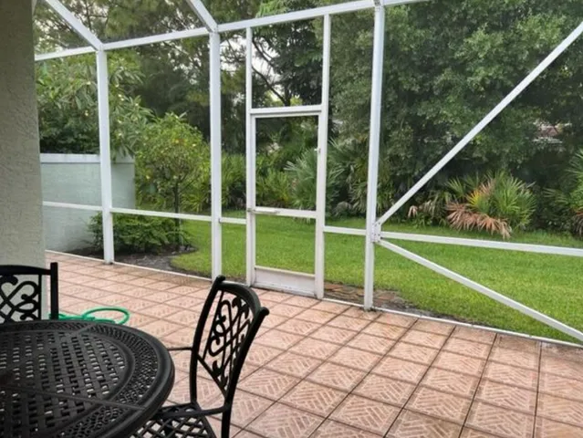 a view of a backyard with sitting area