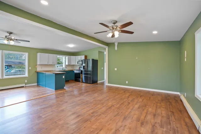 a view of a kitchen with a sink and a window