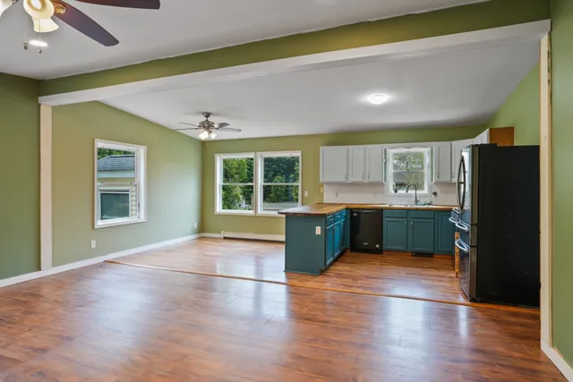 a view of a kitchen with a sink and a window