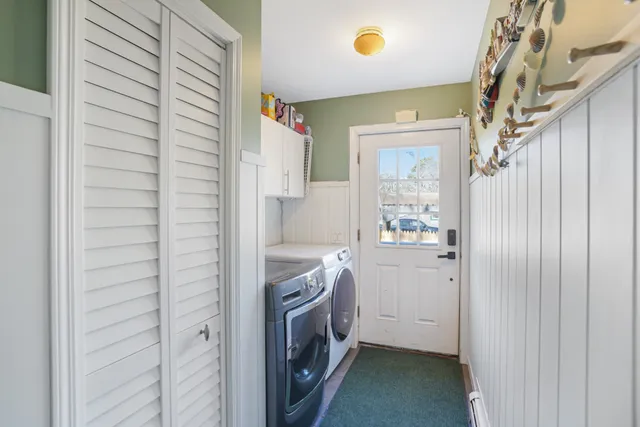 a bathroom with a sink a washer and dryer