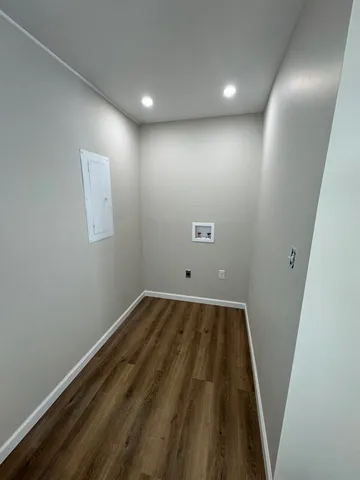 an empty room with wooden floor