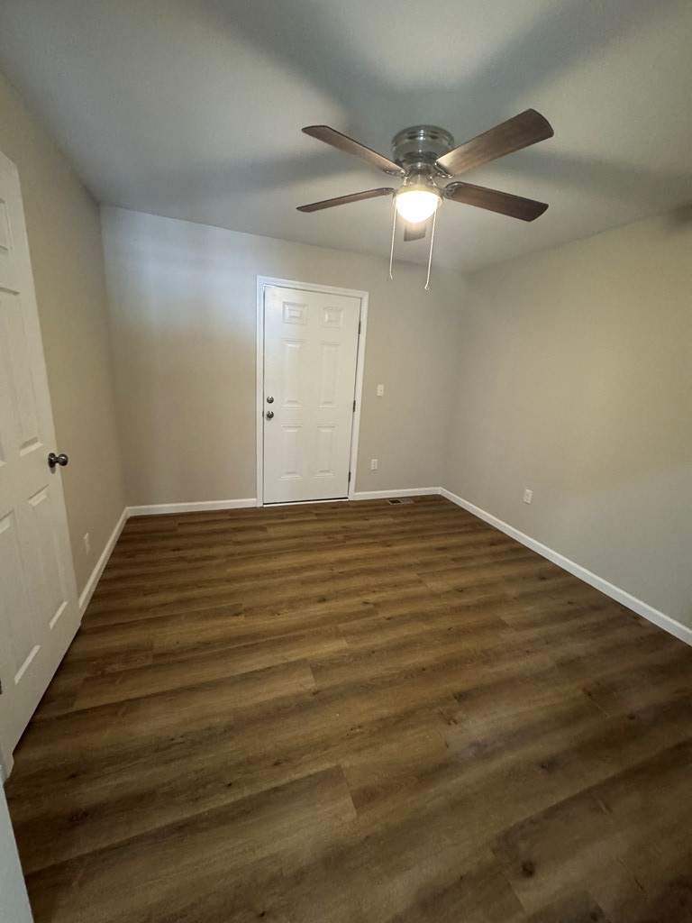 1106 East Railroad Street Waverly, TN 37185 - Photo 15 of 21 wooden floor in an empty room
