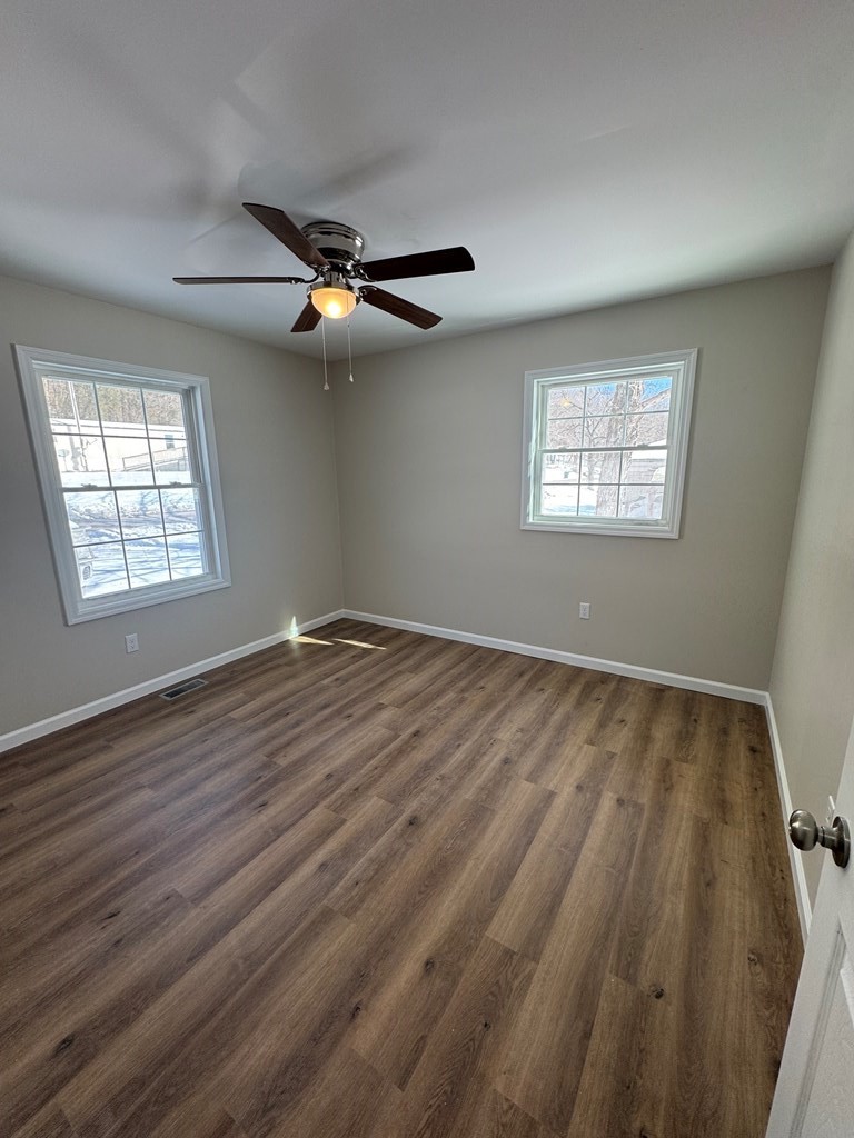 1106 East Railroad Street Waverly, TN 37185 - Photo 18 of 21 wooden floor in an empty room with a window