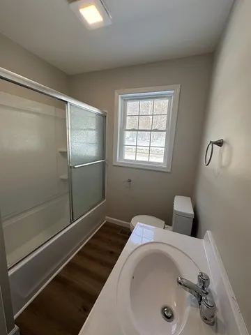 a bathroom with a tub and shower