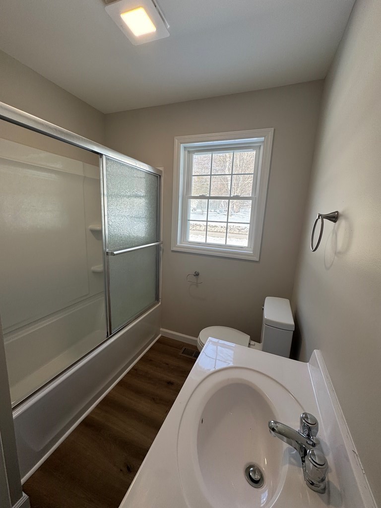 1106 East Railroad Street Waverly, TN 37185 - Photo 20 of 21 a bathroom with a tub and shower