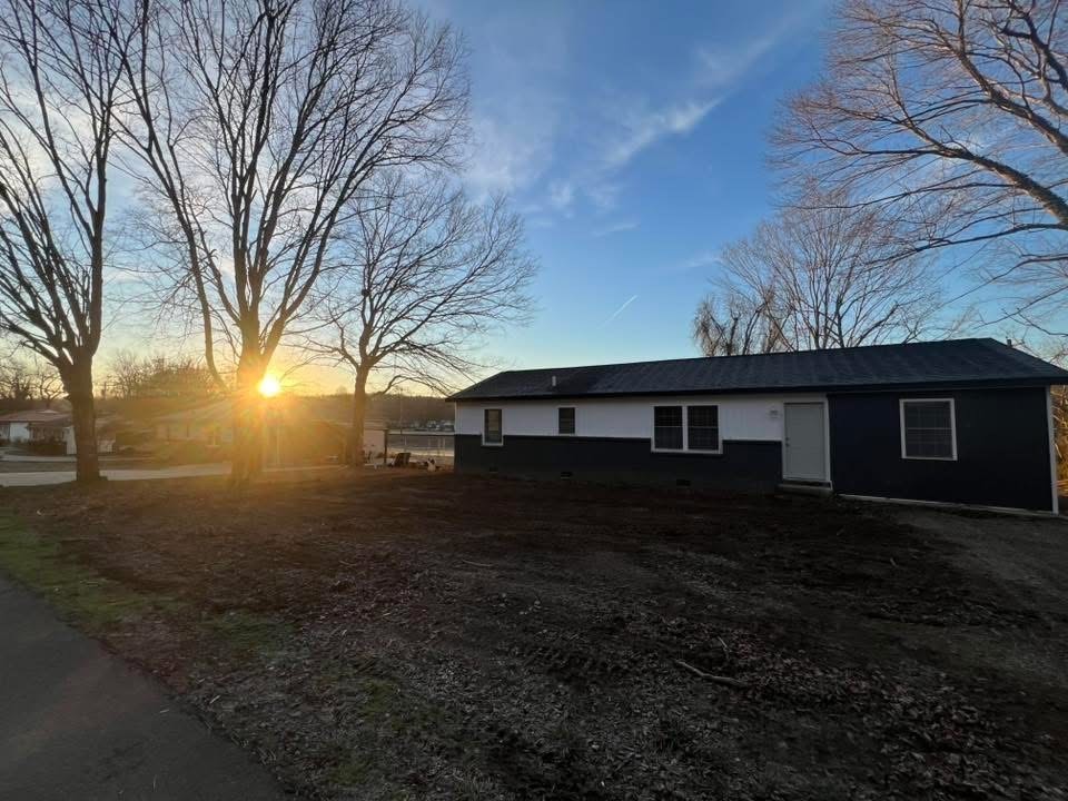 1106 East Railroad Street Waverly, TN 37185 - Photo 3 of 21 a view of house covered with trees