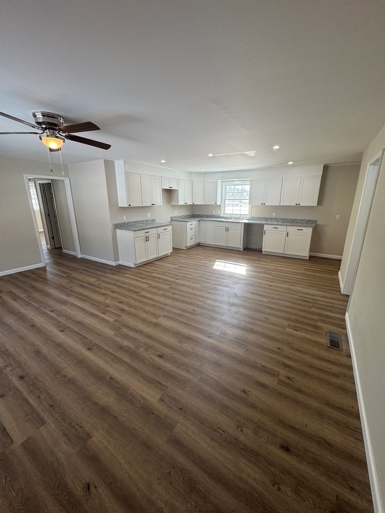 1106 East Railroad Street Waverly, TN 37185 - Photo 8 of 21 a view of empty room with wooden floor